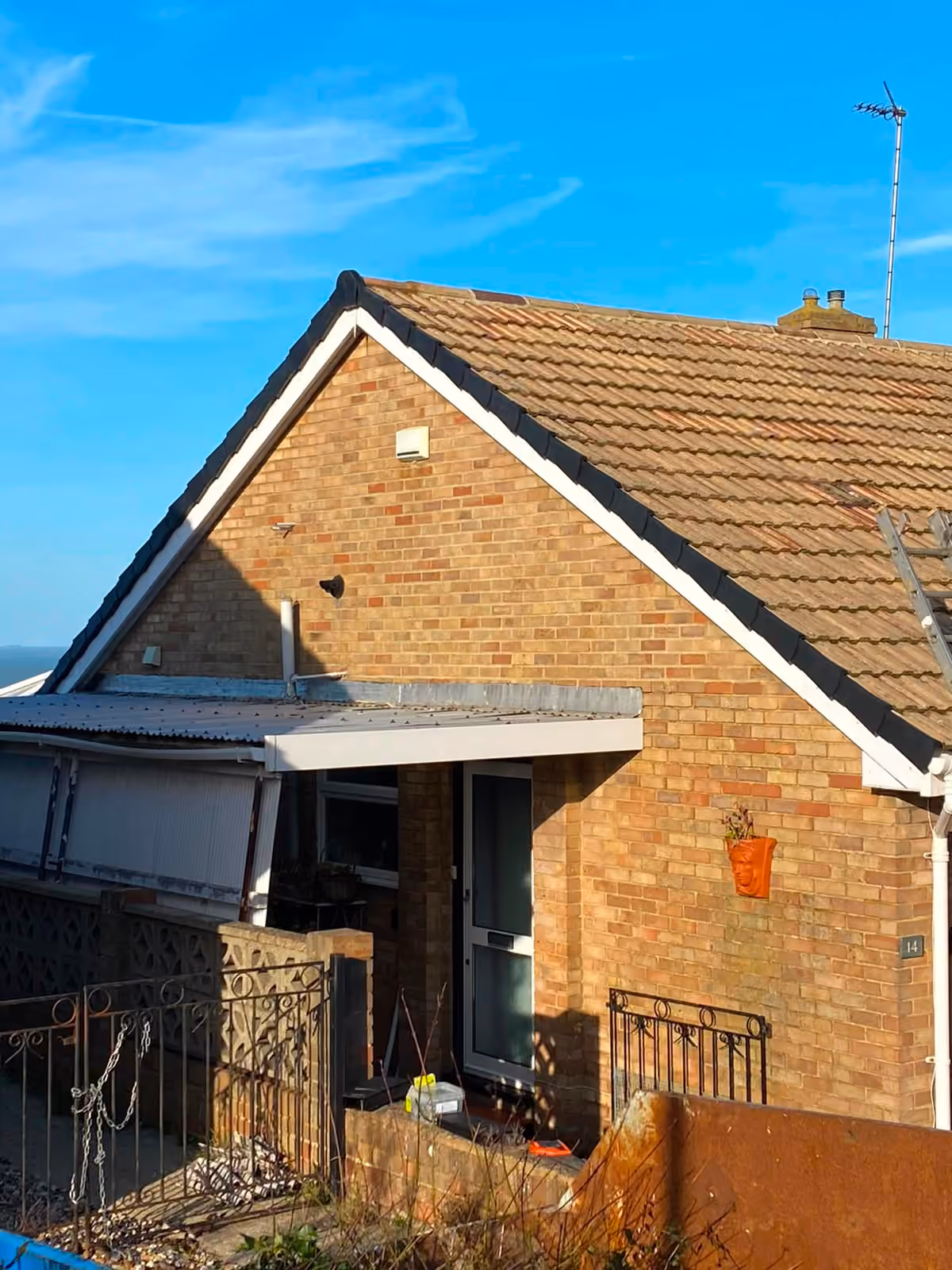 A bungalow roof seen from the scaffold