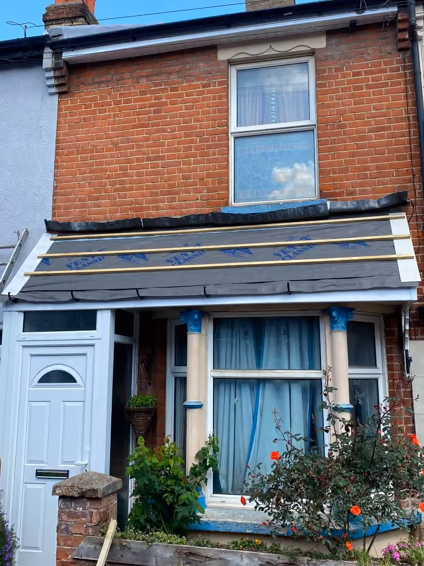A terraced house with new underlay dressed over the front slope