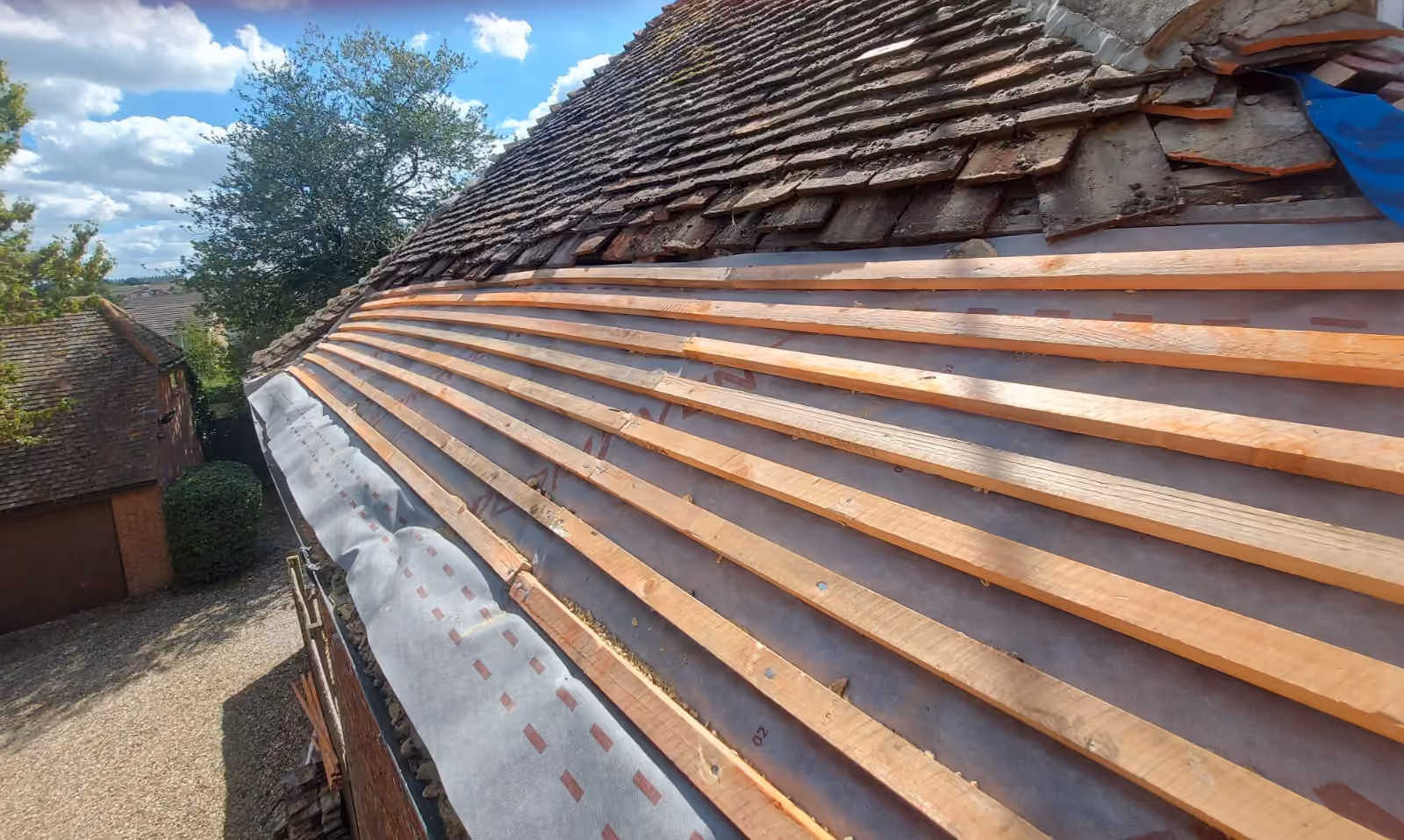 Ridge tiles bedded along the top of a tiled roof