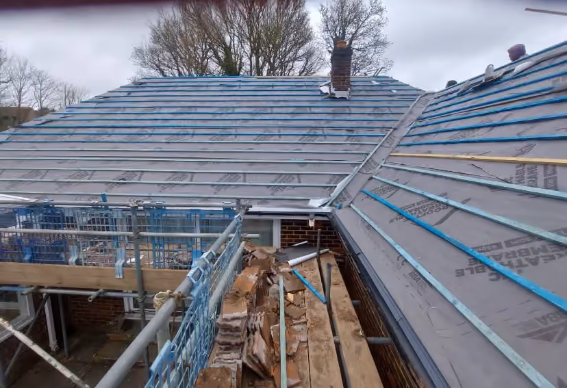 Roof structure exposed with scaffold running along the eaves